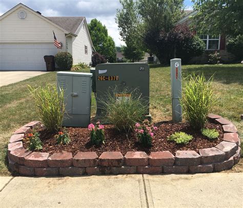 how to hide electrical boxes in yard|hide utility pole decorating ideas.